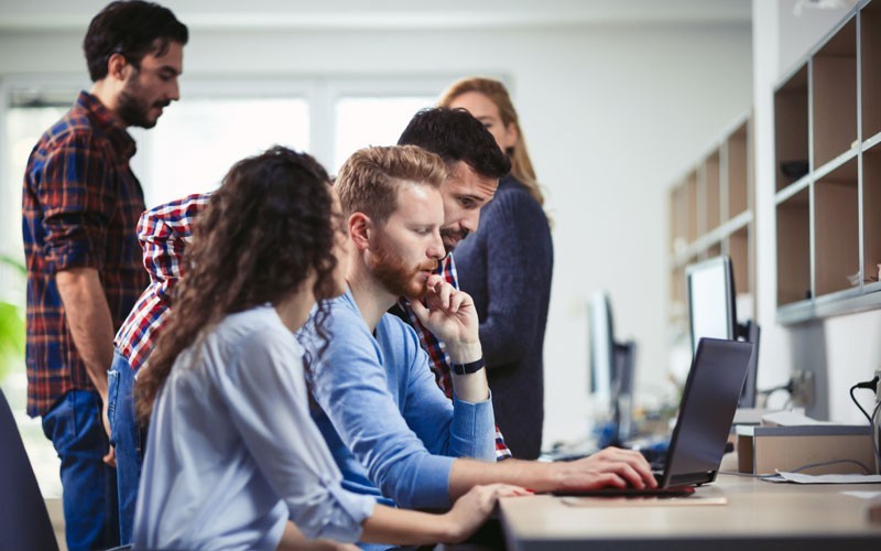 Great performance Business executive on his notebook computer powered by Intel in office
