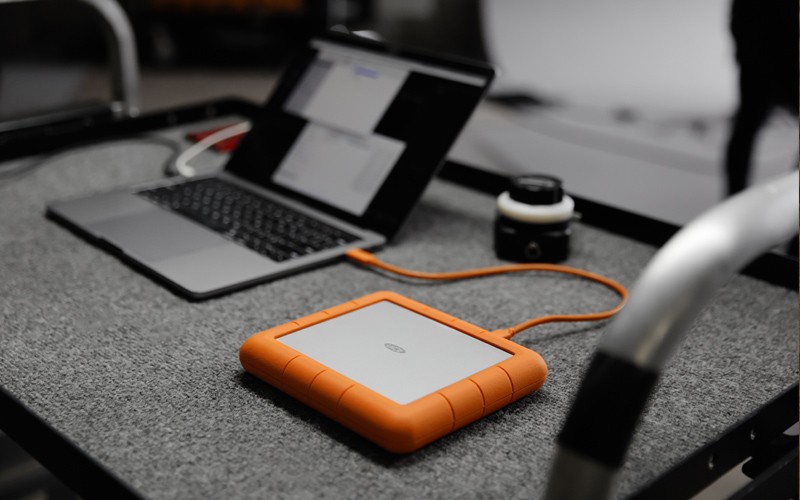 Keep visual hackers in the dark LaCie portable SSD on trolley with laptop