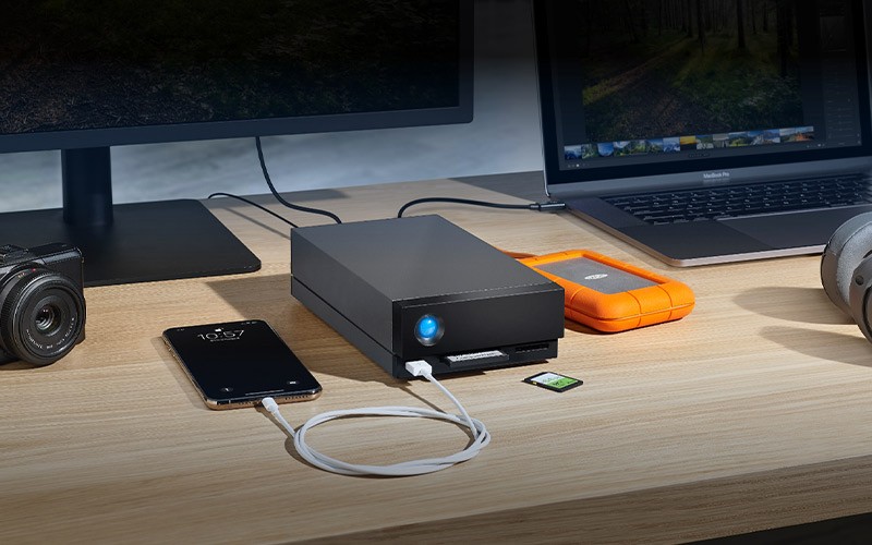 Centralise With an External Hard Drive Thunderbolt 3 Dock 1big dock on a table plugged in
