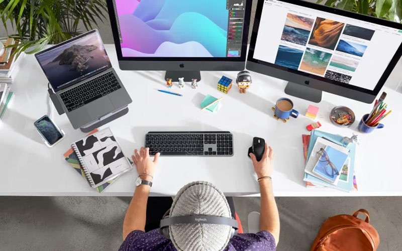 Exceptional navigation and control in the palm of your hand Designer working on PC with Logitech mouse