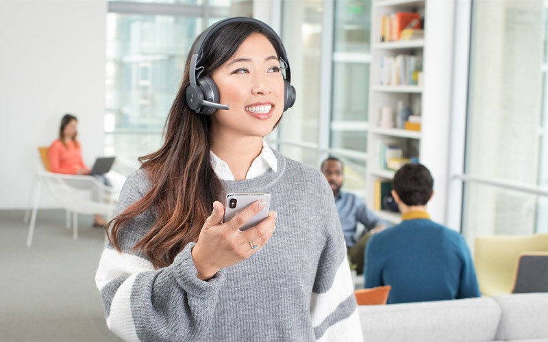 Woman using Logitech headset in an office 981-000914