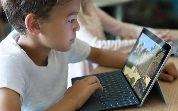 Digital classroom with Microsoft apps Three students working on project