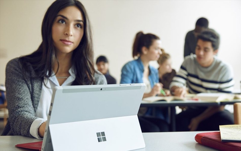 Microsoft Hardware Solutions Microsoft businessman working on Surface Studio device