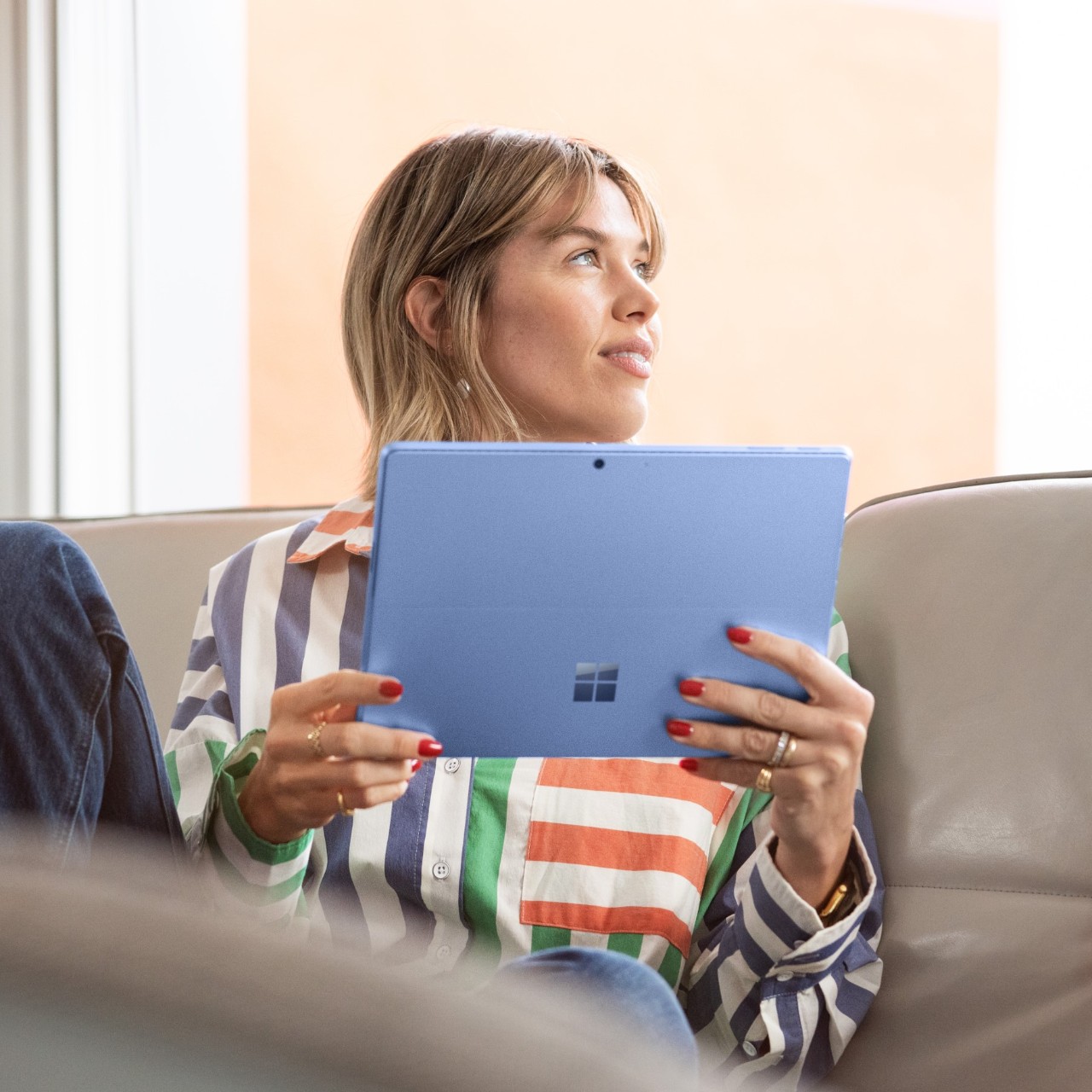 Microsoft 365 for hybrid working woman on microsoft tablet at home