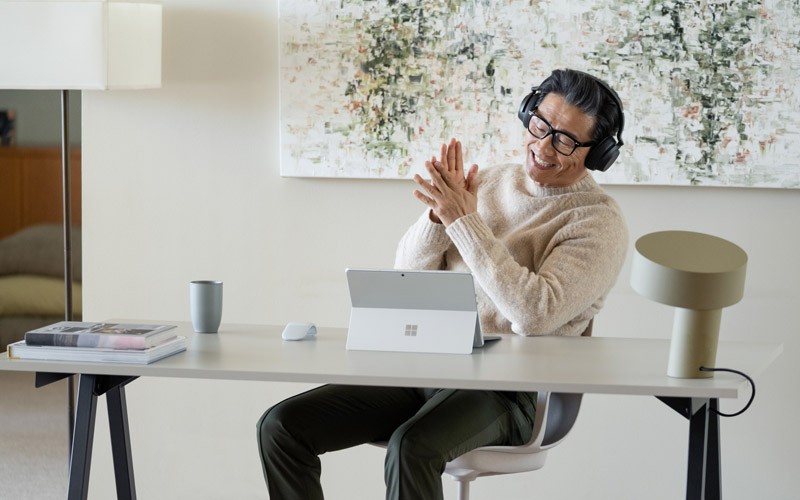 Pay-as-you-go Azure services Man working on Microsoft Surface device