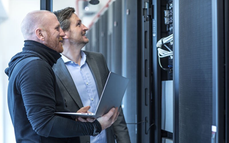 Two men working in a data centre