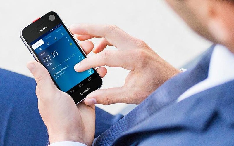 Enjoy dictations on the go Man holding a Philips dictation device