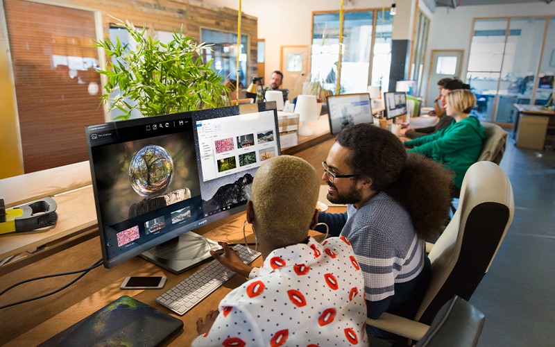 Empower your work place Young woman using a professional display