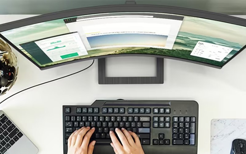 Embrace your field of vision Woman using a curved monitor
