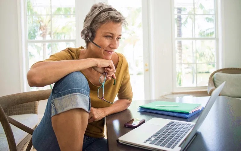 Woman with Poly Voyager 2