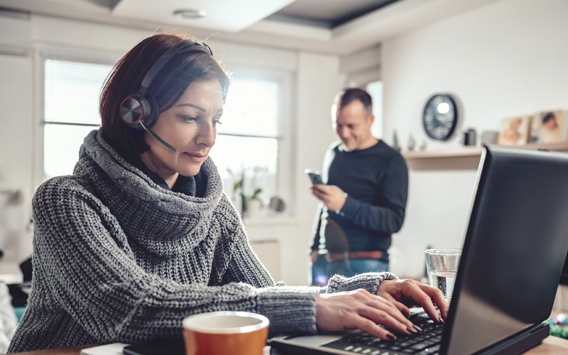 Woman with Poly Voyager 2