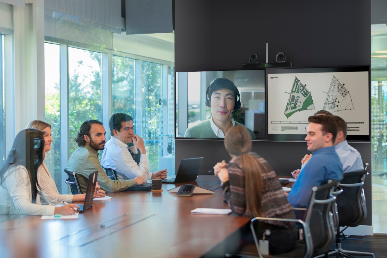 Poly video conferencing solutions Business man using Poly video call