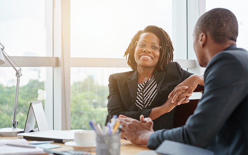 Get faster performance on Azure Two business colleagues during a meeting