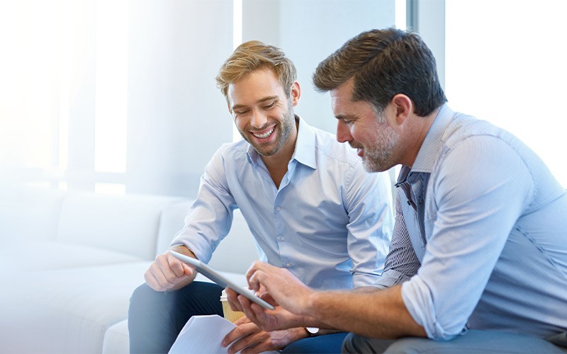 Accelerate cloud migration on Azure Two men working on a tablet