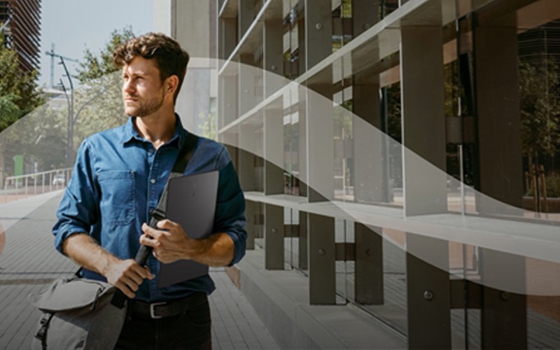 Man walking with Samsung Chromebook