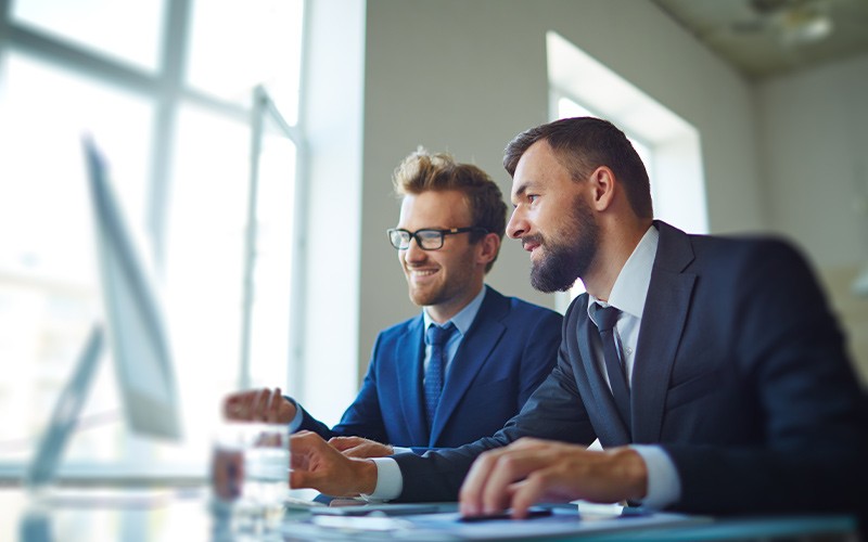 Two men working on a project together