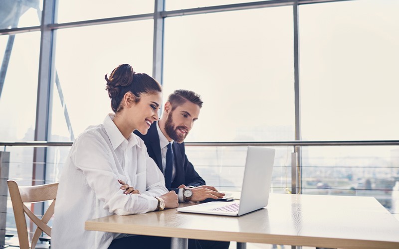 Man and woman working together on a project