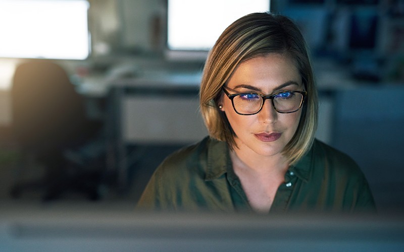 Symantec cloud-based console and built-in integration help you secure your entire infrastructure Close up of woman in glasses working on a laptop