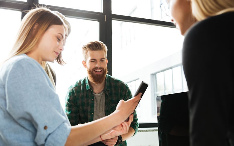 Team looking over tablet